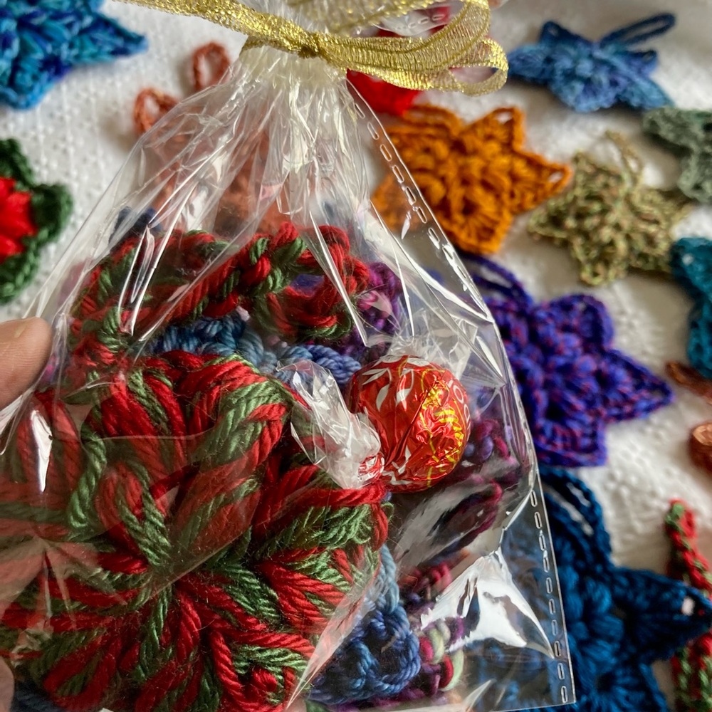 Festive bag of star ornaments, hand-crocheted, 3 in bag, sizes from 3X3 to 5X5